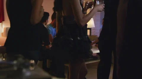 Young adults have a good time dancing together at a house party Stock Footage 34015945