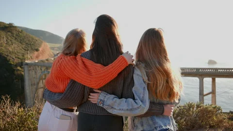 Young, adventurous girls exploring remote ocean coast on weekend Stock Footage 223602248