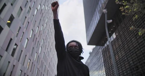 Young african american black man rasises his fists up in solidarity justice. Stock-Footage 202321353