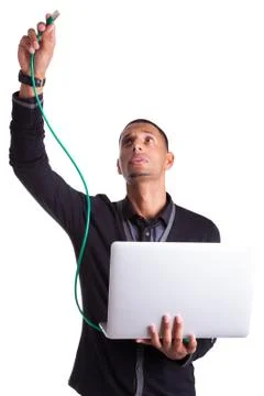 Young african american computer scientist plugin a ethernet cable Stock Photos