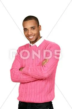 Young african-american man in pink sweater isolated over white background Stock Photos