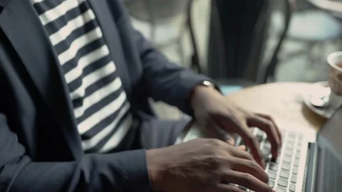 Young African-American man using laptop Stock Footage 155888332