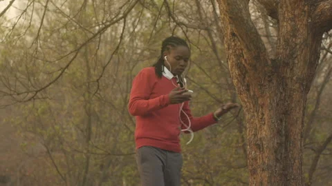 Young African American man using cell phone for video calling Stock Footage 199630319