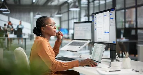 Young African American Manager Using Laptop To Organize Digital Files Efficie Stock Photos