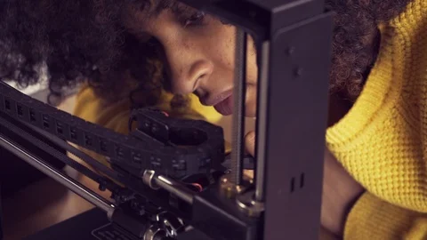 Young African American Woman Works on 3D Printer CU Stock Footage