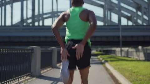 Young African athlete doing butt kicks exercise Stock Footage 117062629