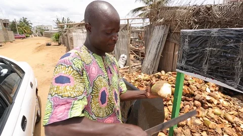 Young African with  coconut Stock Footage 122590038