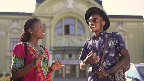 Young african couple talking to each other in a cozy ukrainian city Vídeo Stock 147698175