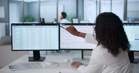 Young African Doctor Using Computer To Update Patient Health Records Carefull Stock Photos