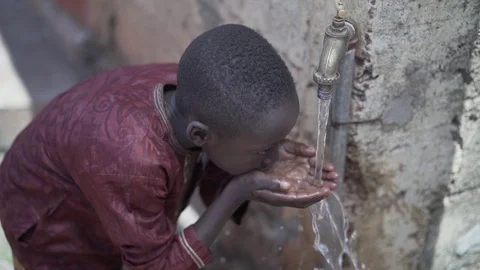 Young African Drinking Fresh Clean Water Stock Footage 122414970