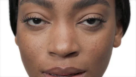 Young African female model using gold patches under the eyes. Beauty and Stock Footage 131428879