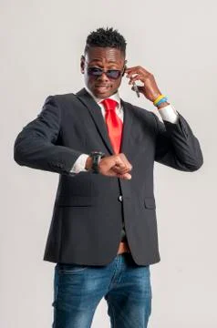 Young african guy looking at cell phone Stock Photos