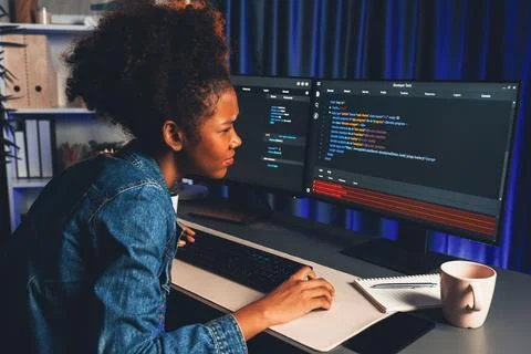 Young African IT developer checking code, concentrate on screen. Tastemaker. 스톡 사진