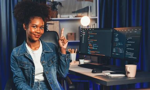 Young African IT developer presenting program and focus on camera. Tastemaker. 스톡 사진