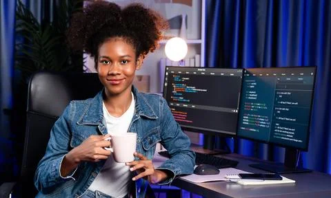 Young African IT developer presenting program and focus on camera. Tastemaker. 스톡 사진