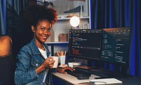 Young African IT developer presenting program and focus on camera. Tastemaker. 스톡 사진