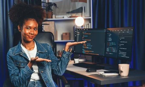 Young African IT developer presenting program and focus on camera. Tastemaker. 스톡 사진