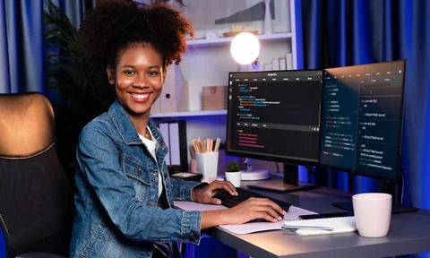 Young African IT developer presenting program and focus on camera. Tastemaker. 스톡 사진