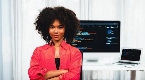 Young African IT developer with smiling and looking at camera. Tastemaker. 스톡 사진