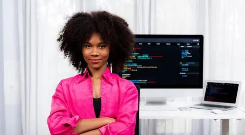Young African IT developer with smiling and looking at camera. Tastemaker. Foto stock