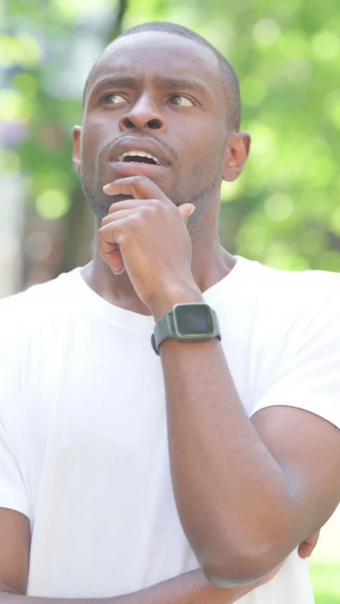 Young African Man Brainstorming New Idea Outdoor in Park, Vertical Video Stock Footage 319023853