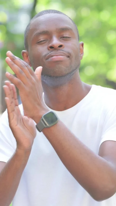 Young African Man Clapping for Team Outdoor in Park, Vertical Video Stock Footage 319023877