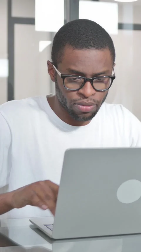Young African Man having Headache at Work, vertical video Stock Footage 324689017