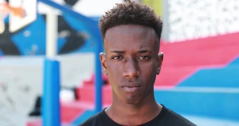 Young african man looking on camera outdoor Stock Footage 183009141