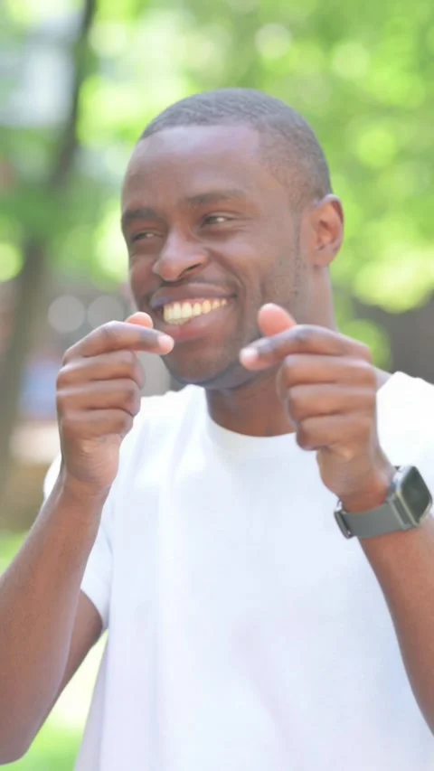Young African Man Pointing at Camera Outdoor in Park, Vertical Video Stock Footage 319023816