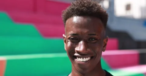 Young african man smiling on camera outdoor Stock Footage 183007438
