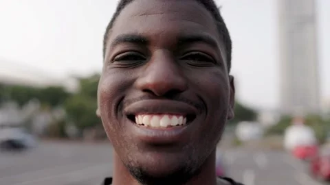 Young African man smiling on camera outdoor Stock Footage 239455266