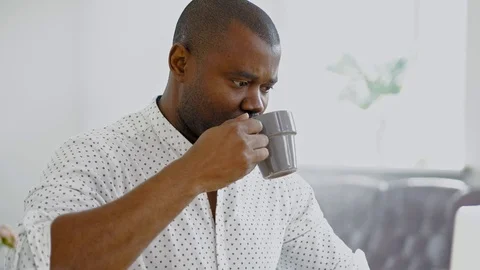 Young African man working on Computer In office and drink coffe. 스톡 동영상 105358580