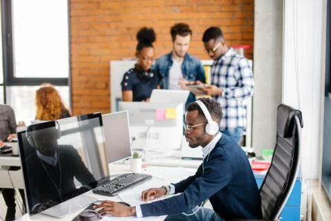 Young African programmer working on personal computer Stock Photos