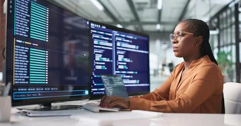 Young African Software Engineer Writing Secure Code On Laptop In Bright Offic Stock Photos
