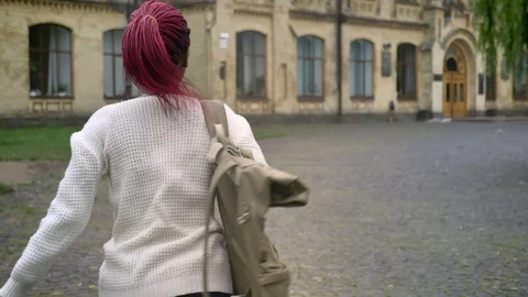 Young african student late for classes and running to university, woman with Video stock 95834801