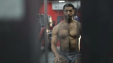 Young afro-american man performs an exercise on the simulator. Stock Footage 101334859