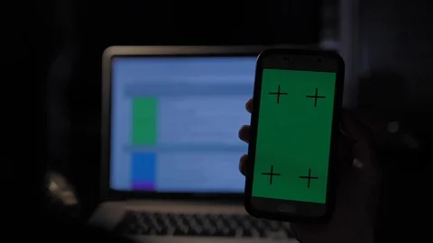 Young afro american man using his smartphone mock-up green screen in his office Stock Footage 110772217