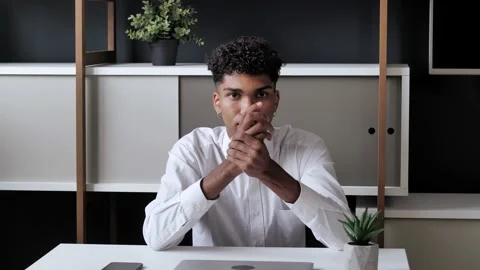 Young afro man student Reducing Pain with Self Massage of Wrist on modern interi Stock Footage 142027657