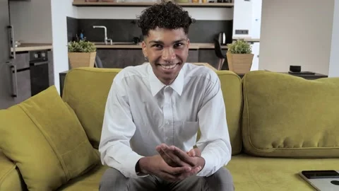 Young afro student talking to camera making conference business call. Confident Video stock 143926363