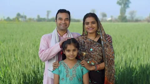 Young age farmer happily posing with his family - village couple, desi family... Stock Footage 270026108