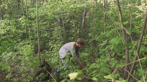 Young aggressive man fights in the Forest Stock Footage 78928226