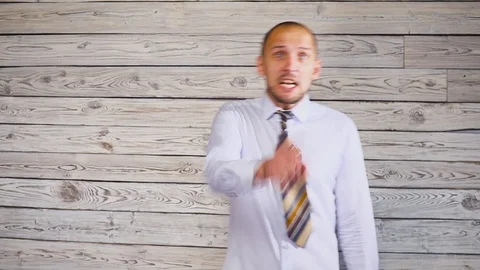 Young aggressive man looking at the camera. Swears. Evil mad boss Видео 95941094