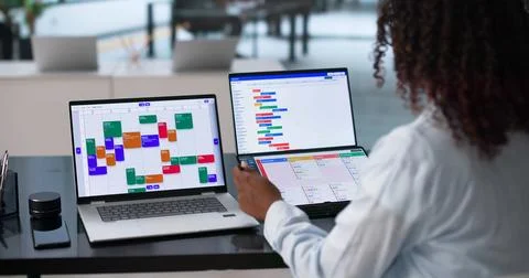 Young Agile Project Manager Updates Task Schedule On Digital Kanban Board. Stock Photos