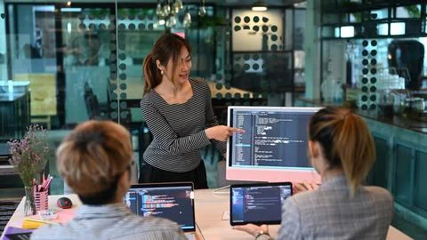 Young AI programmers and IT software developers team doing code programming 스톡 사진