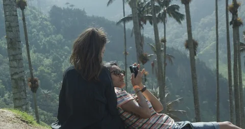 Young alternative girls having fun in tropical wax palm tree valley Stock Footage 86151360