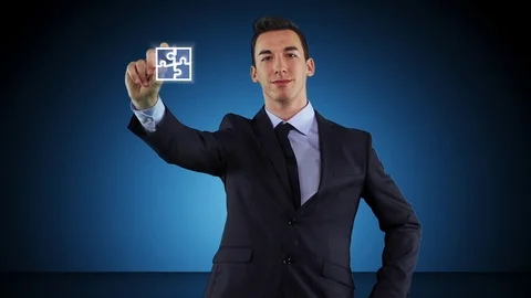 Young Ambitious Businessman Completes The Puzzle Stock Footage 72484601