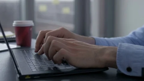 Young ambitious entrepreneur working on a computer in a new office. Stockbeeldmateriaal 82225837