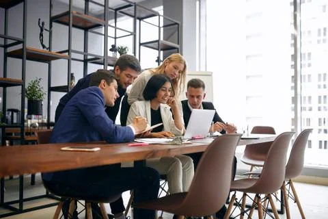 Young ambitious team developing their startup business Stock Photos
