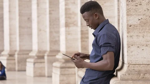Young american african student using digital tablet- outdoor Stock-Footage 92778899