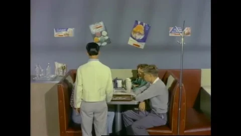 Young American couples having milkshakes at a soda shop in the 1950s. Stock Footage 145406808